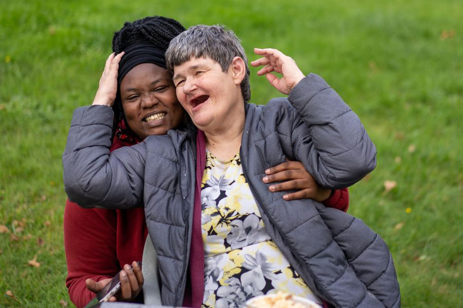 Two women outside laughing