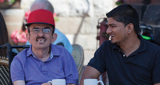 Two men having coffee together